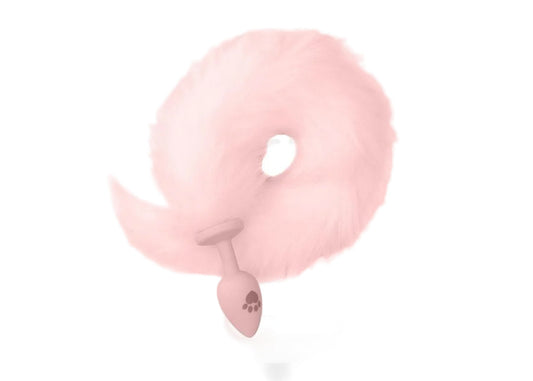 Pink faux fur fox tail silicone butt plug shown on white background.